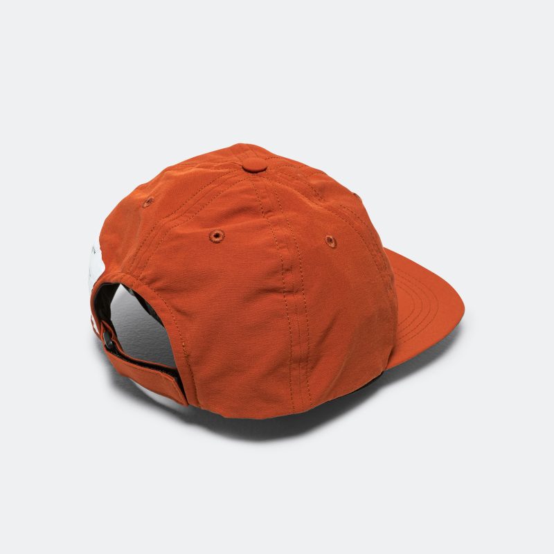 satisy running peace shell running cap rust 2